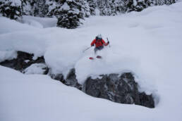 Fearlessly dropping a BC backcountry 5-foot cliff with no hesitation at White Grizzly cat skiing.