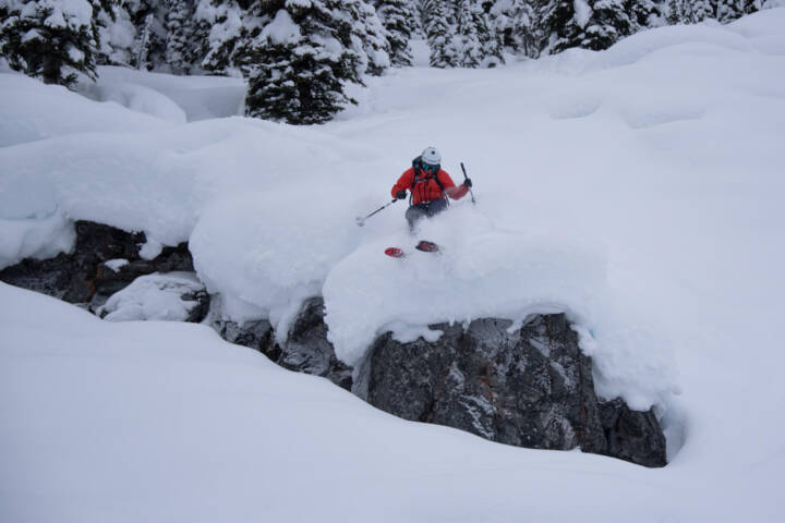 Fearlessly dropping a BC backcountry 5-foot cliff with no hesitation at White Grizzly cat skiing.