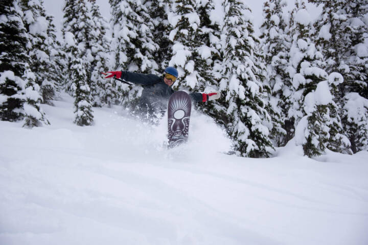Bouncing through pristine powder in the Canadian backcountry at White Grizzly cat skiing in BC.